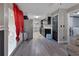 Bright kitchen featuring modern appliances, dark cabinets, and access to both the living and dining areas at 920 Trafalgar St, Deltona, FL 32725