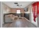 Cozy living room with a comfortable sectional sofa, ceiling fan, and access to the backyard at 920 Trafalgar St, Deltona, FL 32725