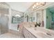 Full bathroom features a double vanity and separate shower and tub at 928 Chickadee Dr, Port Orange, FL 32127