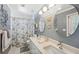 Well-lit bathroom features a double sink vanity and decorative wall art at 928 Chickadee Dr, Port Orange, FL 32127