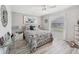 Cozy bedroom with a queen bed, complemented by stylish decor and natural light at 928 Chickadee Dr, Port Orange, FL 32127