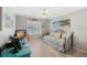 Charming bedroom featuring a daybed, nautical decor, and a view of the outdoors at 928 Chickadee Dr, Port Orange, FL 32127