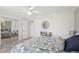 Bright bedroom boasts a mirrored closet and light-filled ambiance at 928 Chickadee Dr, Port Orange, FL 32127
