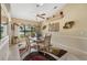 Dining room with high ceilings, a ceiling fan, and a large patterned area rug at 928 Chickadee Dr, Port Orange, FL 32127