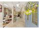 Inviting entryway with tile flooring, decorative lighting, and a view into the spacious living areas at 928 Chickadee Dr, Port Orange, FL 32127