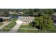 Charming single-story home with a well-manicured lawn, waterfront views, and an attached two-car garage at 928 Chickadee Dr, Port Orange, FL 32127