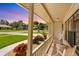 Cozy front porch adorned with vibrant flowers, rocking chairs, and welcoming decor at 928 Chickadee Dr, Port Orange, FL 32127
