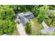 Aerial view of property with a pool, lanai, and well maintained yard at 96 Hollow Branch Xing, Ormond Beach, FL 32174