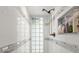 Tile shower with glass block window and tiled shelves at 96 Hollow Branch Xing, Ormond Beach, FL 32174
