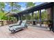 Wooden deck with chaise lounges overlooking a green backyard at 96 Hollow Branch Xing, Ormond Beach, FL 32174