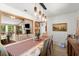 Open dining room that connects to the kitchen and living room, with modern lighting and natural light at 96 Hollow Branch Xing, Ormond Beach, FL 32174