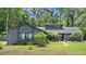 Charming single-Gathering home featuring a well-manicured lawn and lush landscaping at 96 Hollow Branch Xing, Ormond Beach, FL 32174