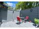 Private patio with outdoor furniture and wood fence at 96 Hollow Branch Xing, Ormond Beach, FL 32174