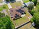 Aerial view of a beautiful backyard with a fenced in yard and solar panels at 2600 Scottville Ave, Deltona, FL 32725