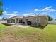 This home features a spacious backyard, covered patio, and solar panels for energy efficiency at 2600 Scottville Ave, Deltona, FL 32725