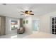 Bright bedroom featuring a ceiling fan, natural light, and backyard views at 2600 Scottville Ave, Deltona, FL 32725