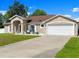 Well maintained home featuring a spacious driveway and inviting front porch at 2600 Scottville Ave, Deltona, FL 32725