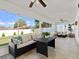 Inviting screened lanai with comfortable seating, a ceiling fan, and a view of the outdoors at 2600 Scottville Ave, Deltona, FL 32725