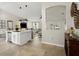 Open concept living area featuring a modern kitchen island and comfortable gray seating at 2600 Scottville Ave, Deltona, FL 32725