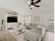 Cozy living room with plush seating, entertainment center, and ample natural light at 2600 Scottville Ave, Deltona, FL 32725
