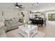 Open concept living space with kitchen island, dining area, and comfortable seating at 2600 Scottville Ave, Deltona, FL 32725