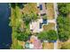 Overhead shot of lakefront property with metal roof and inviting yard at 10 Madera Rd, Debary, FL 32713
