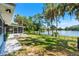 Serene backyard with lush greenery and scenic lake views at 10 Madera Rd, Debary, FL 32713
