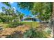 Expansive backyard with lush lawn, fenced perimeter and beautiful lake views at 10 Madera Rd, Debary, FL 32713