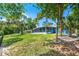 Spacious backyard featuring lush greenery and a relaxing hammock at 10 Madera Rd, Debary, FL 32713
