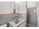 Bathroom featuring retro gray tiling, clean lines, and updated fixtures at 10 Madera Rd, Debary, FL 32713