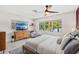 Bright bedroom features lake views, light-colored walls, and modern wood furnishings at 10 Madera Rd, Debary, FL 32713