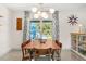 Bright dining room featuring a modern chandelier and Terrazzo flooring at 10 Madera Rd, Debary, FL 32713