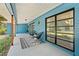 Stylish front porch with black chairs, geometric rug, and modern lighting at 10 Madera Rd, Debary, FL 32713