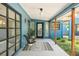 Charming porch with modern decor, black chairs, and an inviting entrance at 10 Madera Rd, Debary, FL 32713