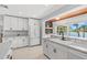 Updated kitchen featuring white cabinets, countertops, and a view of the lake at 10 Madera Rd, Debary, FL 32713