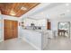 Modern kitchen with white cabinets, stainless steel appliances, and an island with bar seating at 10 Madera Rd, Debary, FL 32713