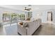 Bright living room featuring a view of the lake and screened-in porch at 10 Madera Rd, Debary, FL 32713