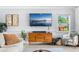 Comfortable living room featuring a mounted flat screen TV and a view of the backyard at 10 Madera Rd, Debary, FL 32713