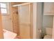 Bathroom with tiled shower stall, commode and vanity with sink at 1010 Hanford Dr, Deltona, FL 32738