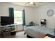 Cozy bedroom with natural light, ceiling fan and neutral carpet at 1010 Hanford Dr, Deltona, FL 32738