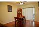 Dining area with hardwood floors, decorative accents, and a view of the backyard at 1010 Hanford Dr, Deltona, FL 32738