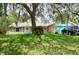 Inviting single-Gathering home with lush lawn, mature trees and charming curb appeal at 1010 Hanford Dr, Deltona, FL 32738