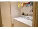 Practical laundry room equipped with washer, dryer, and storage shelf at 1010 Hanford Dr, Deltona, FL 32738