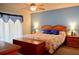 Relaxing main bedroom with sliding doors, coastal decor, and comfortable furnishings at 1010 Hanford Dr, Deltona, FL 32738
