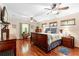 Spacious bedroom with hardwood floors, lots of natural light, and ceiling fans at 1056 Reynolds Rd, De Leon Springs, FL 32130