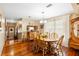 A dining room featuring hardwood floors, beautiful chandelier and large windows that provide natural light at 1056 Reynolds Rd, De Leon Springs, FL 32130