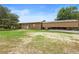 Exterior shot of barn with covered parking and plenty of open space at 1056 Reynolds Rd, De Leon Springs, FL 32130