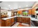 Charming kitchen with hardwood cabinets, white countertops, and stainless steel appliances at 1056 Reynolds Rd, De Leon Springs, FL 32130