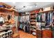 Spacious walk-in closet with custom wood shelving and storage solutions for clothing and accessories at 1056 Reynolds Rd, De Leon Springs, FL 32130