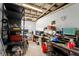 Cluttered workshop featuring various tools, equipment, and storage solutions at 1056 Reynolds Rd, De Leon Springs, FL 32130